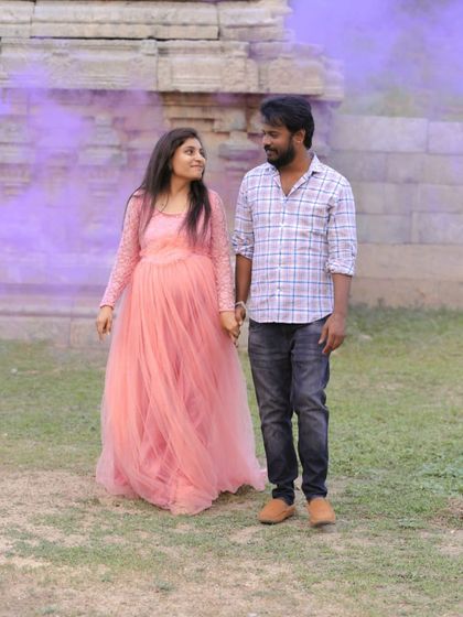 A walk to remember. This couple used a purple smoke bomb to add a magical effect to their maternity shoot, with the light pink gown standing out beautifully.