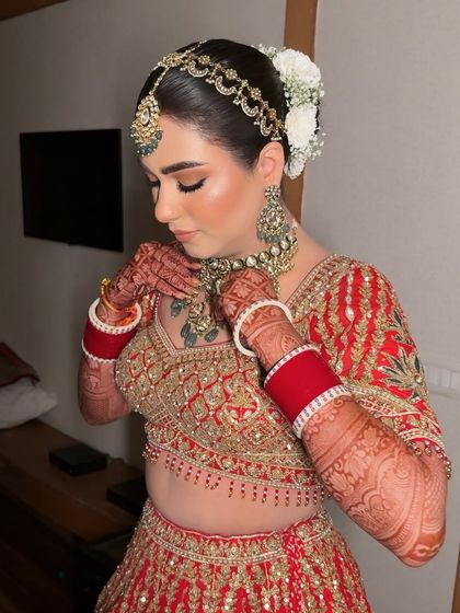 A candid moment of the bride adjusting her necklace. My makeup is designed to be sweat-proof and long-lasting, so it stays perfect through all the movements and rituals of the day.