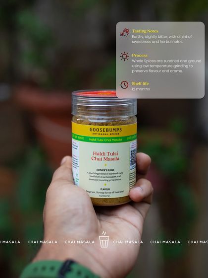 Holding a jar of my Haldi Tulsi Chai Masala, this image highlights its tasting notes and process. It's earthy and slightly bitter with herbal notes, made from sun-dried and low-temperature ground spices.
