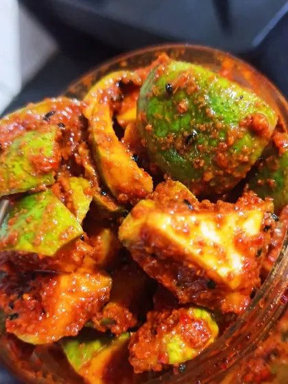 A close-up of my classic Mango Pickle, made with fresh, raw mangoes and a traditional blend of spices. You can see the quality and texture that comes from a truly handmade process, with no artificial colors.