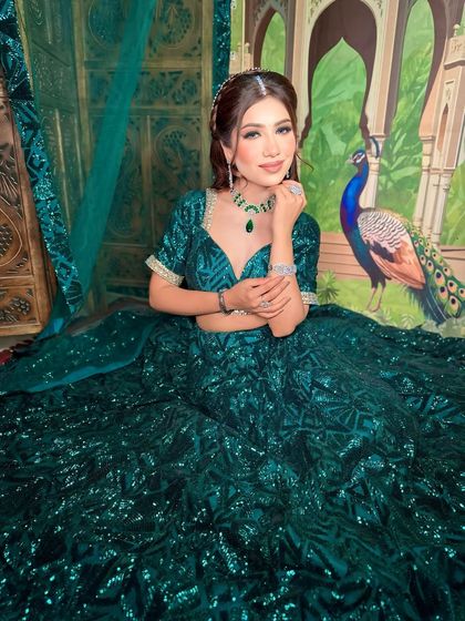 A confident pose showing off the complete look. The soft glam makeup is perfect for any festive occasion.