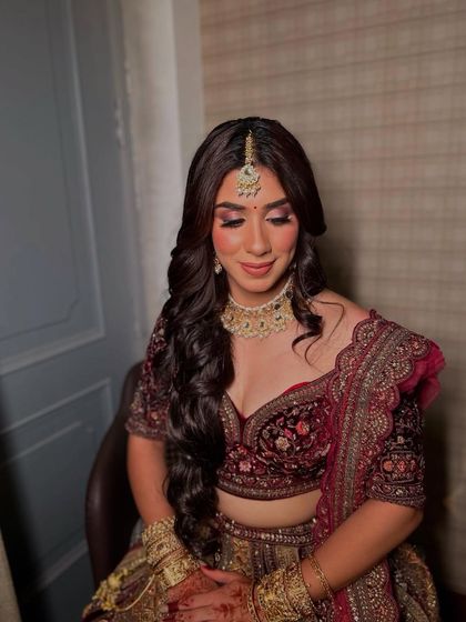 Bridal glam in its full glory. This look is perfect for a cocktail or reception, with dramatic eyes and beautiful, flowing hair.