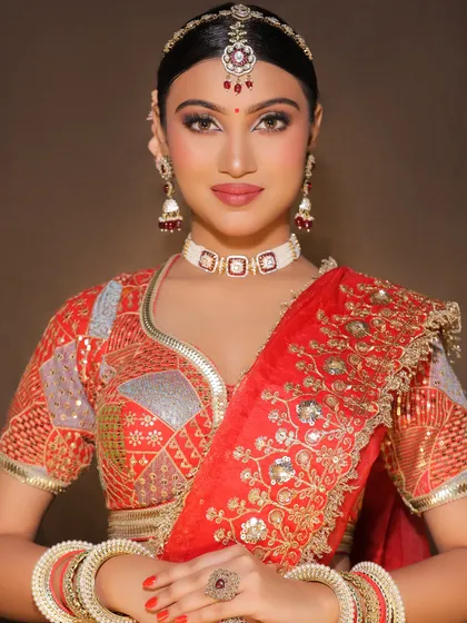 The full view of a traditional bridal look, showcasing the perfectly draped dupatta and coordinated jewelry, all part of the comprehensive training.