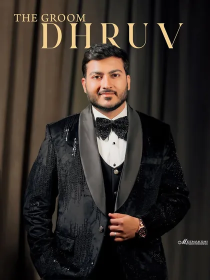 A dapper portrait of the groom, Dhruv, in his sequined tuxedo. This classic shot highlights the groom's style and confidence on his engagement night.