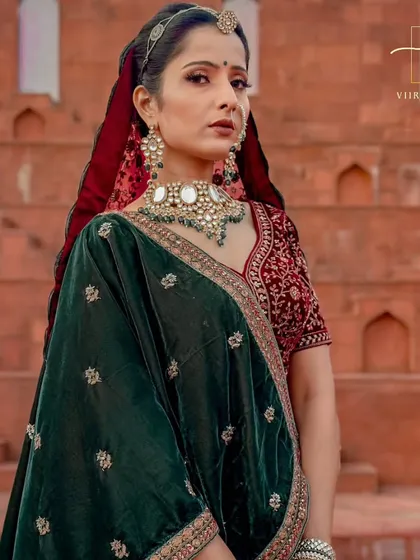 A close-up on the rich, dark green velvet dupatta with delicate embroidery. This shows the quality of the fabrics I offer.