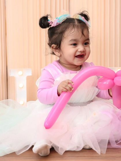 A vibrant 'Minions' themed birthday party, with yellow and blue decor, character cutouts, and fun props, creating a mischievous and joyful atmosphere.