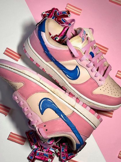 The finished Boomer-themed Nike Dunks. The base of the shoe was chai-dipped to give it a vintage look, then painted with the iconic pink and blue colors. A true 90s throwback.