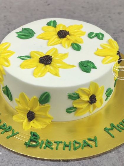 A cheerful cake with 3D painted buttercream sunflowers. This technique gives the flowers a beautiful, textured look.