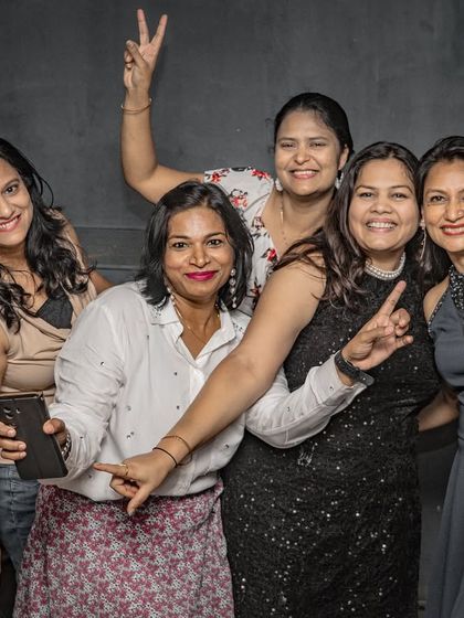 A group of friends having a great time, capturing the moment with a selfie.