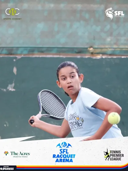 Intense focus from one of our young players during a match. We train our athletes not just in technique, but also in the mental toughness required to compete and win.