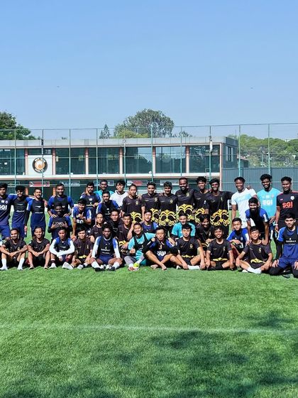 Our team photo after a friendly match with Sporting Club Bengaluru. These experiences are invaluable for our players' growth.