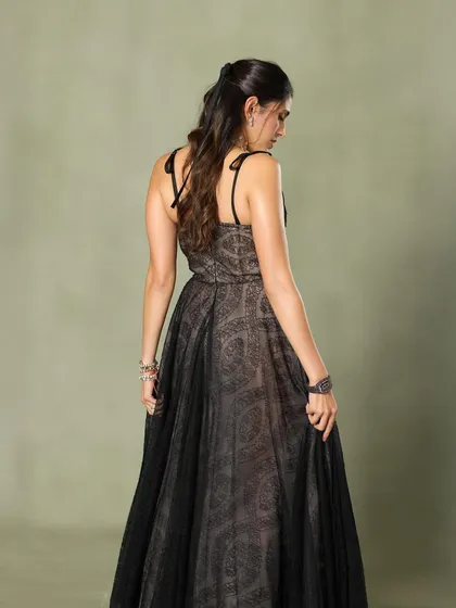 A back view of the Giambattista Valli gown, highlighting its delicate straps and flowing fabric.