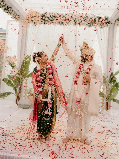 There is nothing more magical than the 'akshata' ceremony, where the couple is showered with blessings and flower petals. This is the moment a new life begins together, and I make sure to capture its pure joy.