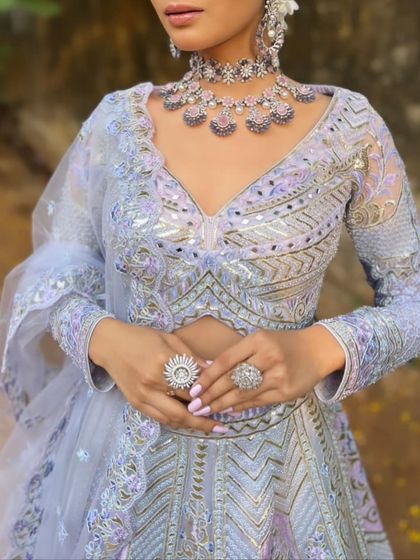 The intricate details on the blouse and waist of this lavender lehenga are simply stunning. It’s a perfect example of the modern craftsmanship in our collection.