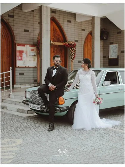 Classic elegance for a timeless love story. A vintage car adds a touch of sophisticated charm to this Christian wedding, showcasing how I can source luxury rides to perfectly match the theme of your day.