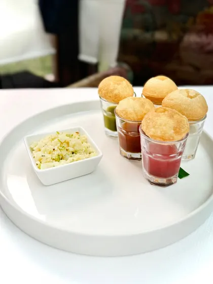 Who says street snacks can’t have a little sparkle? Our semolina puchkas, a beloved street food, are dressed for the occasion with five flavour-packed waters and a side of nostalgia, served with fine-dining elegance.