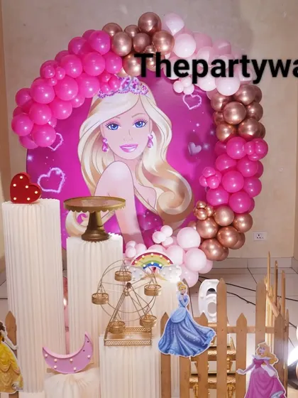 Another look at the popular Barbie theme, showing the round backdrop and themed props like the mini Ferris wheel. The hot pink and rose gold balloons are always a favorite combination.