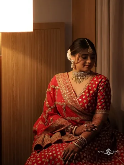 Another seated portrait, capturing a moment of quiet reflection. These are the calm moments before the celebration begins.