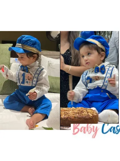 Celebrating a first birthday in style. This little gentleman is wearing our royal blue set with personalized suspenders and a matching cap, looking absolutely charming for his big day.