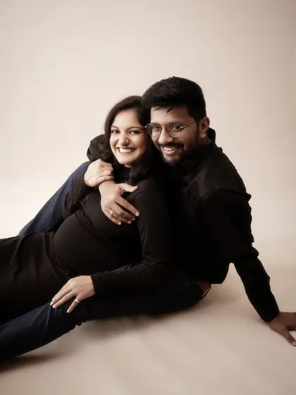 The warmth of their embrace is palpable in this shot. I used a soft, warm light to enhance the feeling of comfort and love, creating a cozy and intimate portrait of their life together.
