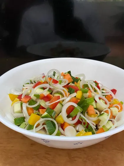 A simple bowl of chopped salad, perfect for a light and healthy lunch. It is all about using fresh, seasonal ingredients to create something simple and nourishing.