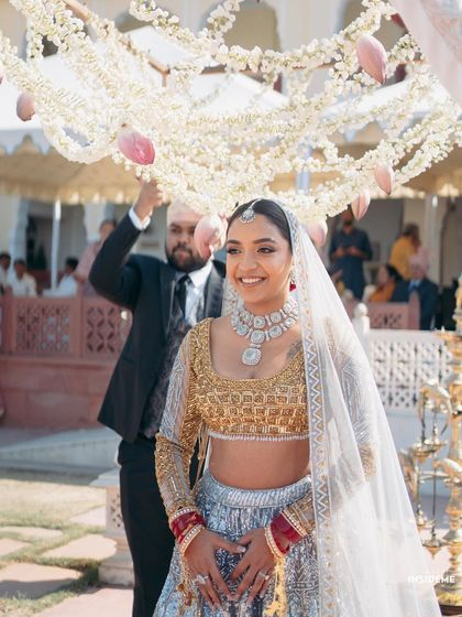 Mishi's grand entrance. Her radiant smile and glowing skin are the perfect accessories for her unique bridal outfit.
