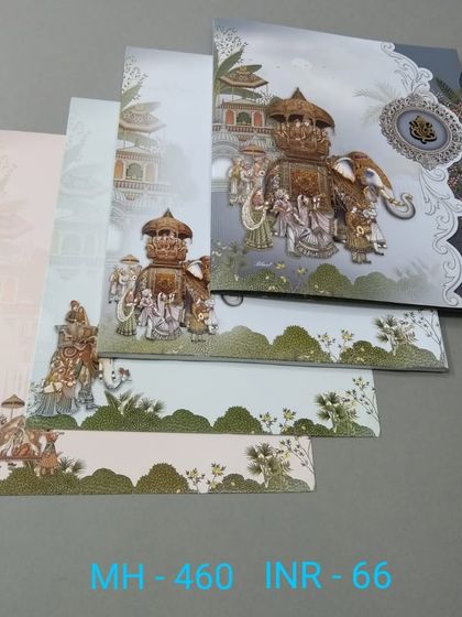 This invitation captures a full wedding procession, with the groom on an elephant and guests celebrating. The artwork is detailed and spans across the card and its inserts.