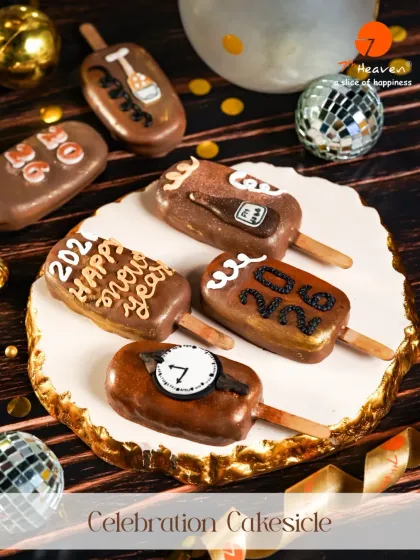 Ring in the new year with our Celebration Cakesicles. These chocolate-coated treats are decorated with festive designs like clocks and champagne bottles, perfect for any 2026 party.