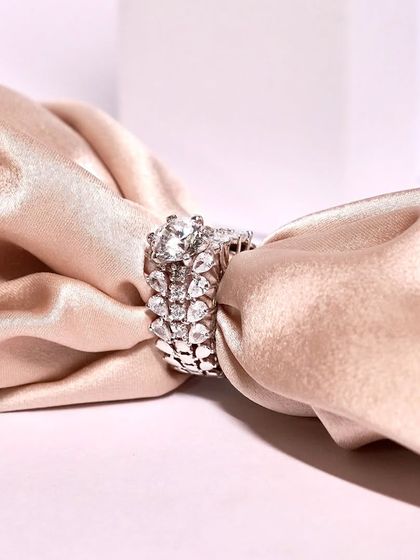 A stunning and intricate ring, perfect for making a statement. The detailed craftsmanship and sparkling stones are truly captivating.