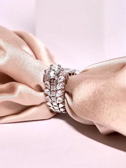 A stunning and intricate ring, perfect for making a statement. The detailed craftsmanship and sparkling stones are truly captivating.
