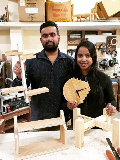 Gaurav and Shreya with the collection of projects they built. They made a clock, a planter stand, a shelf, and a unique multi-level display stand.