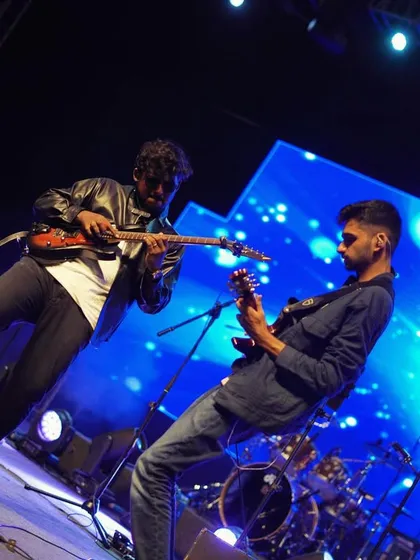 This is what it looks like when raagas meet riffs. My amazing guitarists trading solos during our rock-infused set, bringing a completely different power to traditional Carnatic melodies.