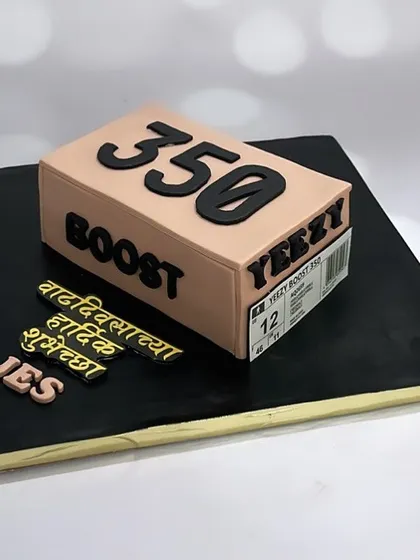 A one-of-a-kind Yeezy shoe box cake for the ultimate shoe enthusiast. The entire box is edible.