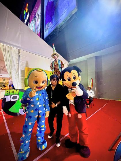 A fun moment from a family-friendly event, posing with Cocomelon and Mickey Mouse mascots. I am versatile and can cater my services to a wide range of events, not just clubs.