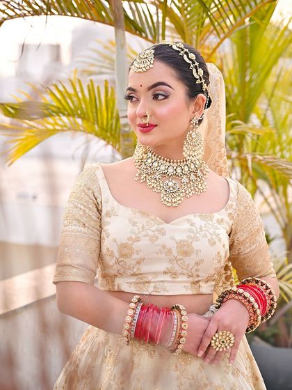 A three-quarter view of the bride, looking elegant and poised.