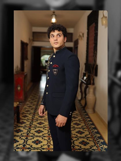 The side profile of this designer Bandhgala highlights the sharp tailoring and the custom crest detail. It’s these small, personal touches that elevate a garment from just clothing to a piece of your story.