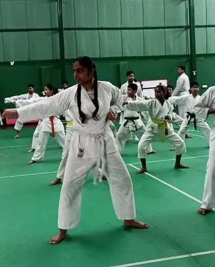 A wide shot of students performing Kata in unison during their grading. This demonstrates their discipline and ability to work as a team.