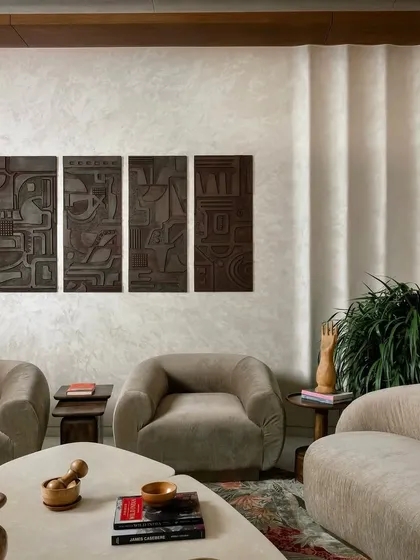 For this Jaipur home, I created a set of four deeply textured wooden art panels. This kind of sculptural wall art adds a modern and sophisticated touch, playing with light and shadow to create a dramatic effect.