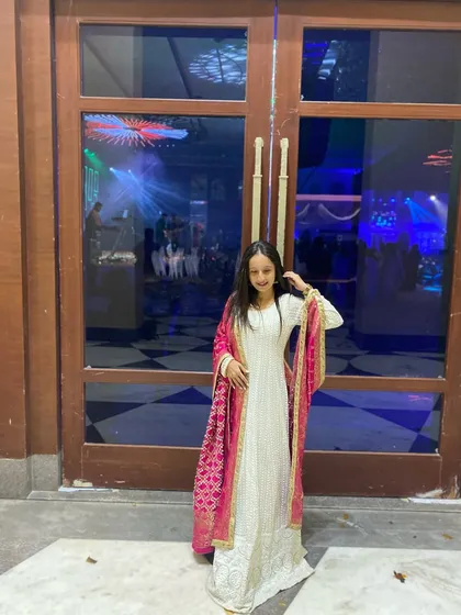 Another look from the Jaipur Sangeet. The combination of a simple white Anarkali with a bright pink Bandhani dupatta is one of my favorite classic looks.