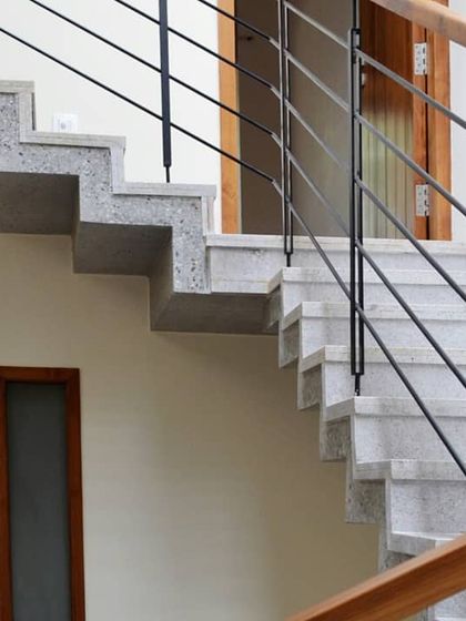 The zigzag profile of the concrete staircase is a simple yet powerful geometric statement.