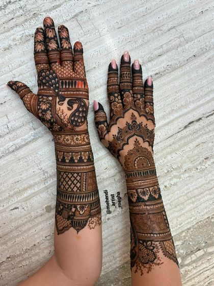 The other side of the beautiful engagement mehendi, showcasing a different but complementary pattern that maintains the regal and intricate theme.