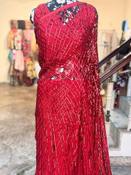 A full view of the 'LAALPARI' saree, showing its dramatic and fashionable silhouette. It's the perfect choice for a cocktail party or a festive celebration where you want to stand out.