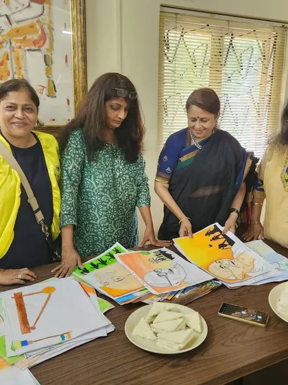 The members of the Lions Club and I discussing the artworks. It was a fun afternoon with super energetic children.