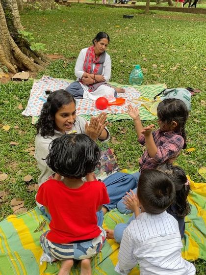 The joy of participation! A child claps along during an interactive part of the story. We encourage kids to be active listeners and contributors to the tale.