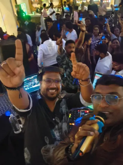 A selfie with my partner in crime, DJ Wink, and a packed dance floor behind us. This was at a birthday bash for a Kannada actor, where we kept the South Indian VDJ set going until 1 AM.