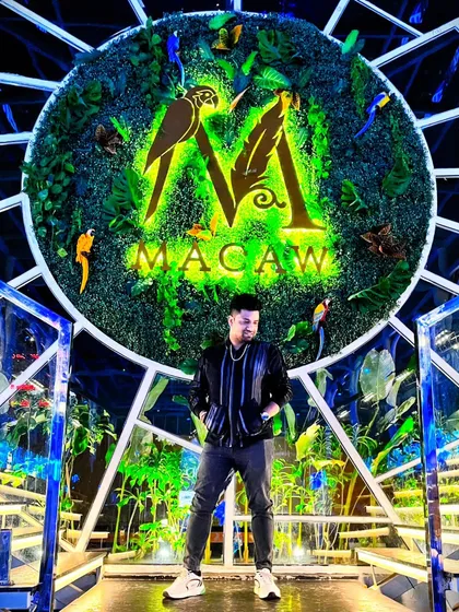 Posing at Macaw, one of the premier venues I perform at regularly. I bring a professional and stylish presence that matches the high-energy nightlife scene of top clubs and private events.