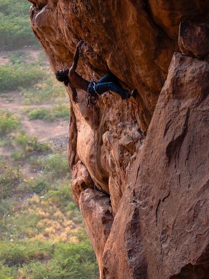 Subhash on a steep overhang, a stunning shot that captures the athleticism and beauty of sport climbing in Badami, a favorite spot for many of our climbers.