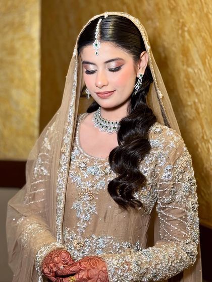 A serene portrait of Sumbul. Her soft glam makeup and simple jewelry create a look of understated elegance for her Walima.