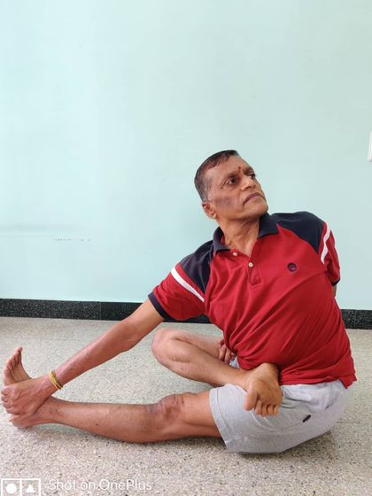 Ardha Matsyendrasana (Half Lord of the Fishes Pose). A deep seated twist that tones the abdominal organs and increases spinal flexibility.