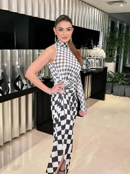 A powerful pose that shows off the entire look. This is how you make a statement at any party.